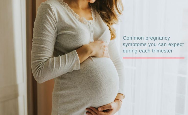Pregnant woman holding her belly